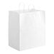 A close-up of a Duro white paper shopping bag with handles.