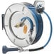 A T&S stainless steel hose reel with a hose attached.