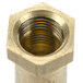 A brass 3/8-27UNS threaded nut.