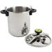A close-up of a silver stainless steel Monix pressure cooker pot with black handles and a lid.