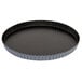 A black Matfer Bourgeat fluted tart pan with a metal rim.