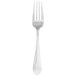 A silver Walco stainless steel dinner fork with a white background.
