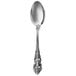 A Walco Classic Baroque stainless steel teaspoon with a design on the handle.