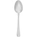 A Walco stainless steel serving spoon with an egg-shaped handle on a white background.
