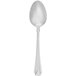 A Walco Athenian stainless steel serving spoon with a silver handle.