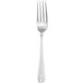 A silver Walco Athenian dinner fork with a white background.