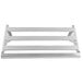 A white metal wall-mounted utensil rack with a shelf and four slats.
