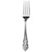 A silver Walco Classic Baroque stainless steel dinner fork with a handle.