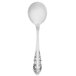 A Walco stainless steel bouillon spoon with a Baroque design on the handle.
