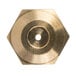 A close-up of a hexagon shaped brass object with a hole in the middle.