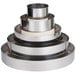 A stack of Matfer Bourgeat stainless steel round wedding cake ring frames.