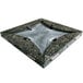 An Uba Tuba granite tabletop with a drop leaf design on a metal base.