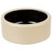 A white stoneware ramekin with a black rim.