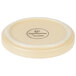 A white stoneware plate with a black circular design.
