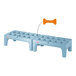 A blue plastic Metro bow tie dunnage rack with a bone attached to it.