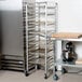 A Channel 401AN sheet pan rack next to a large refrigerator.