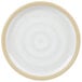 A white plate with a tan rim.