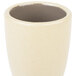 A grey stoneware cup with a brown rim.