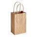 A bundle of 250 brown Duro natural kraft paper shopping bags with handles.