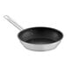 A close-up of a stainless steel Vigor SS1 Series frying pan with a black interior.