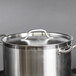 A Vigor stainless steel lid on a large pot.