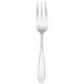 A silver Walco Modernaire table fork with a white handle.