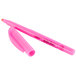 A close-up of a Bic Brite Liner pink highlighter pen with a white tip.