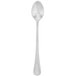 A silver Walco iced tea spoon with a white handle.