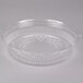 A clear plastic container with a round lid.
