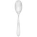 A Walco stainless steel dessert spoon with a white handle and silver spoon.