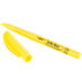 A close-up of a yellow Bic Brite Liner highlighter pen with a black tip.