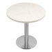 A white circular Art Marble Furniture table top with a quartz surface.