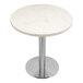 A white circular Art Marble Furniture Carrera White Quartz table top on a silver base.