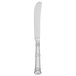 A Walco stainless steel butter knife with a solid silver handle.