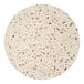 A close up of a white Art Marble Furniture round quartz tabletop with small holes in it.