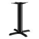A Lancaster Table & Seating black cast iron table base with four legs.