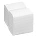 A stack of white interfold dispenser napkins.