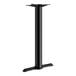 A black Lancaster Table & Seating cast iron bar height end column table base.