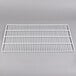A white metal grid shelf.