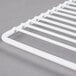 A white metal grid shelf.