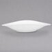 A white Villeroy & Boch porcelain oval plate with a curved edge on a grey background.