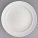 A white Villeroy & Boch bone porcelain round platter with a white rim.