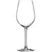 A close-up of a clear Chef & Sommelier wine glass with a stem.