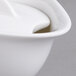 A close-up of a white Villeroy & Boch porcelain sugar bowl with a lid.