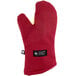 A red oven mitt with a white label.