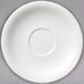 A white porcelain saucer with a circular rim and a circle in the center.