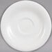 A white Villeroy & Boch Dune porcelain saucer with a rim.