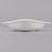 A Villeroy & Boch Dune white porcelain deep bowl with a curved edge on a gray background.