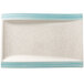 A white rectangular porcelain plate with aquamarine stripes on the edges.