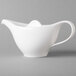 A Villeroy & Boch white porcelain teapot with a handle.